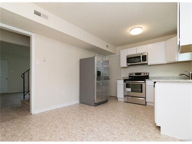Kitchen with SS appliances and granite countertops
