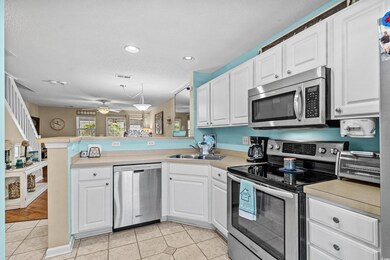 Kitchen with appliances with stainless steel finis