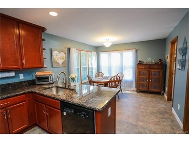 Updated kitchen with granite, cherry cabinetry, up