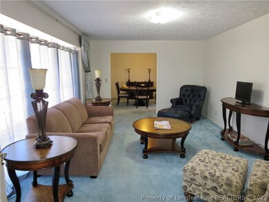 Living room which flows to the dining room.