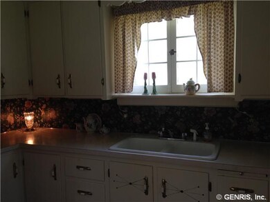Kitchen. The kitchen cabinets are quaintly set in 