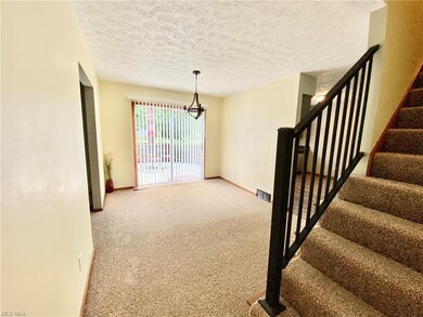 A view of the Dining Room and the slider leading to the deck.