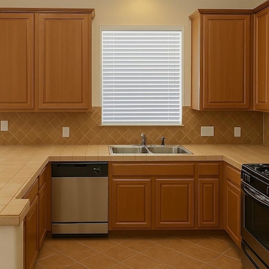 Kitchen featuring stainless steel appliances, til