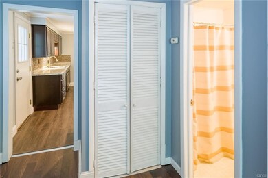 Hallway, leading to the true heart of this home...