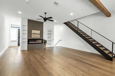 Floor to Ceiling Fireplace, Open Living and Dining area, Powder Bath with Balcony