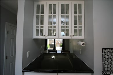 Kitchen pass through with bar seating.