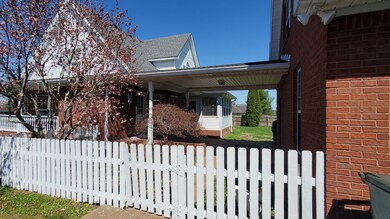 Breezeway connecting main house with detached garage. 