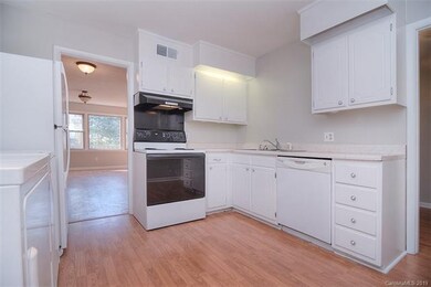 Plenty of storage offered in this modest kitchen a