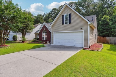Traditional home with driveway and a garage