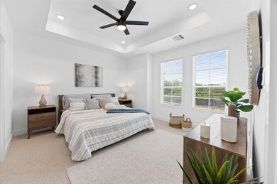 Step into this spacious primary bedroom featuring