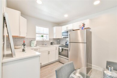 Kitchen with light hardwood / wood-style flooring,