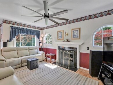 Living room with gas fireplace, new ceiling fan, n