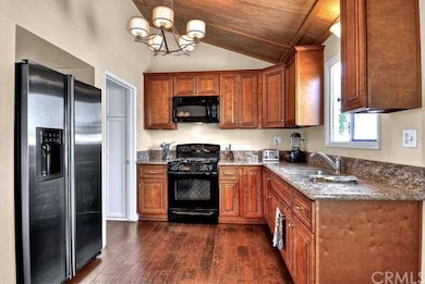 Updated kitchen with granite counters and warm ton