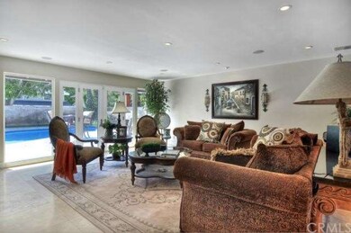 French doors open to pool area