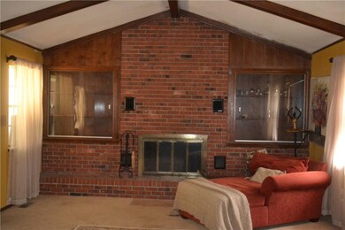 Living Area with built-ins and wood burning firepl