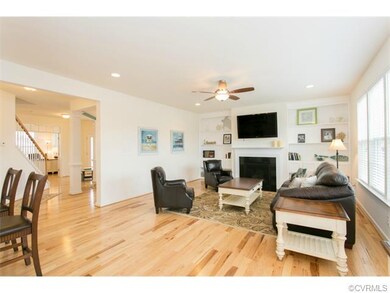 Great room with hickory floors, built-ins, gas fir