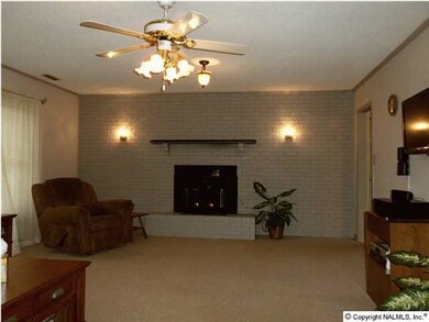 Relaxing Great Room includes a Wood Burning Fireplace for cozy fall and winter evenings and Large Windows