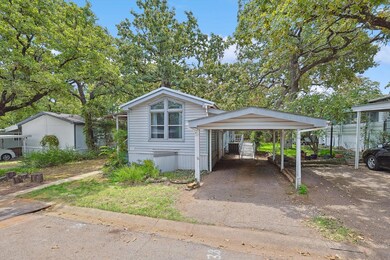Carport leads to heavy duty steel ramp for ease of access in wheelchair or walker. Ramp leads to backdoor.