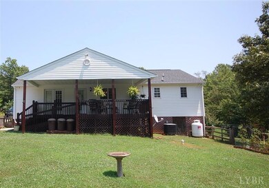Rear of home with covered porch