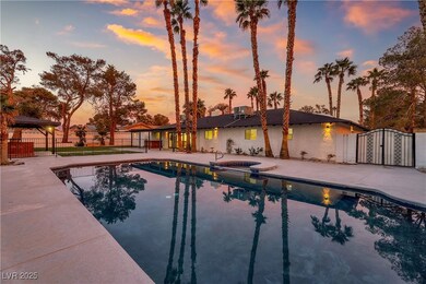 Pool at dusk featuring a patio area, a pool with c