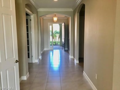 Corridor with arched walkways, crown molding, base