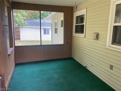 Unfurnished sunroom featuring a wealth of natural light