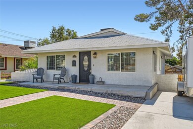 Bungalow-style house featuring stucco siding, a fr