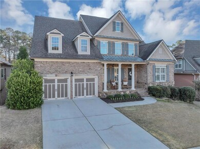Craftsman-style home featuring driveway, a front y