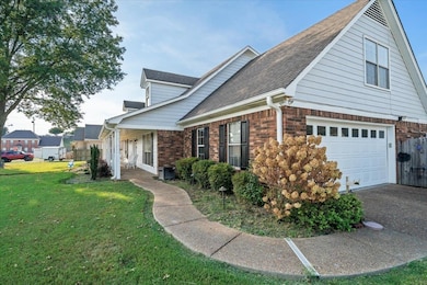 View of property exterior with brick siding, a garage, a shingled roof, and covered porch
