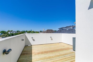 Generously sized and freshly updated, the rooftop terrace offers a versatile open-air venue for gatherings or quiet moments under the sky.