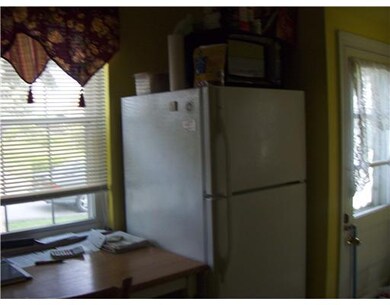 Kitchen. Compact kitchen includes range and refrig