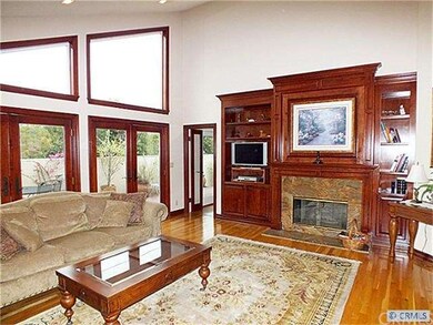 The fireplace with granite hearth and cherry mantl