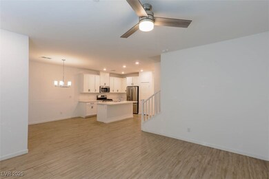 Living room featuring baseboards, visible vents, s