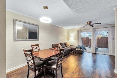 Dining space with baseboards, ornamental molding, 