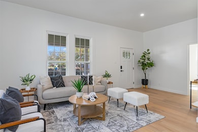 Living room featuring light wood-style floors and