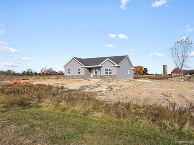 View of front facade with stone siding