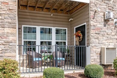 RELAXING front covered patio with attached storage