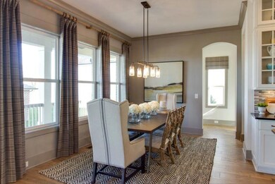 Other view of dining room in model.  Same wall colors, trim and lights in picture in this home. 