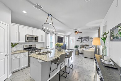The kitchen cabinets were recently painted to give this lovely home a more updated feel.