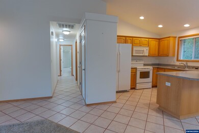 The hallway leads to all 3 bedrooms and the 2nd ba