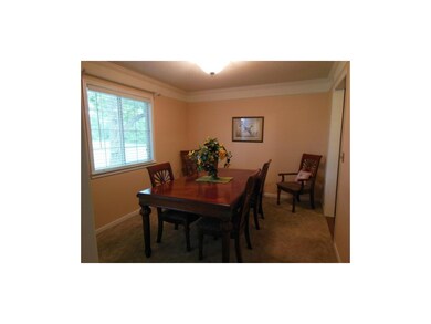 Lovely dining room has plenty of space.