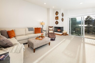Living Room with Large Slider and Lake and Mountain Views