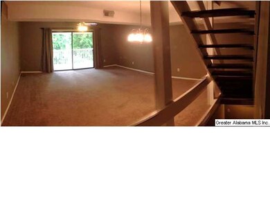 Sliding doors lead to covered balcony