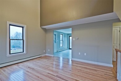 SPACIOUS LIVING ROOM WITH HARDWOOD...