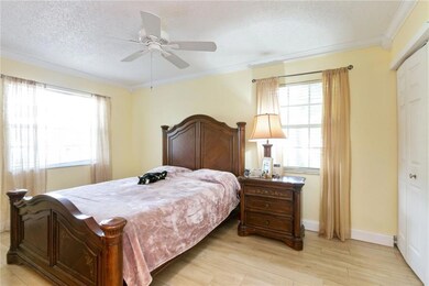 Master bedroom with two closets, crown molding, ce