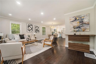 Living area with wood finished floors, baseboards,