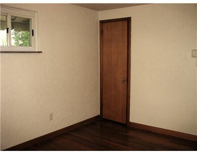 Bedroom. Hardwood floors in all three bedrooms.