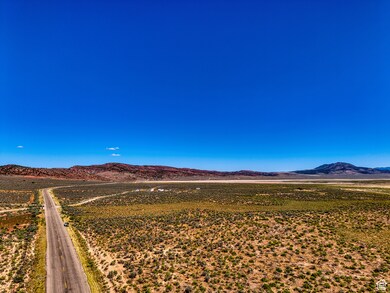 View of mountain backdrop featuring rural landscape