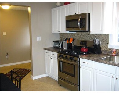 Kitchen. Walk in from the back door, kitchen to th