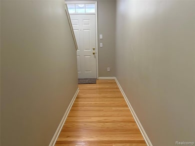 Front Door Indoor/Outdoor Doorway to front porch with wood finished floors